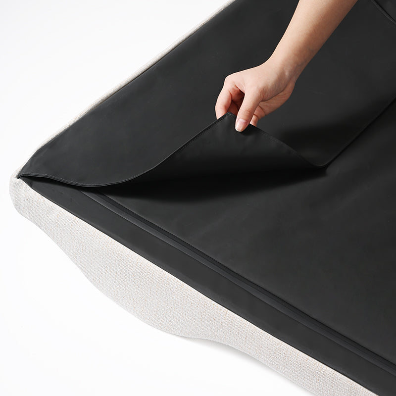 Zenest Ridge medium dog bed: Hand lifts waterproof layer, showing washable core.